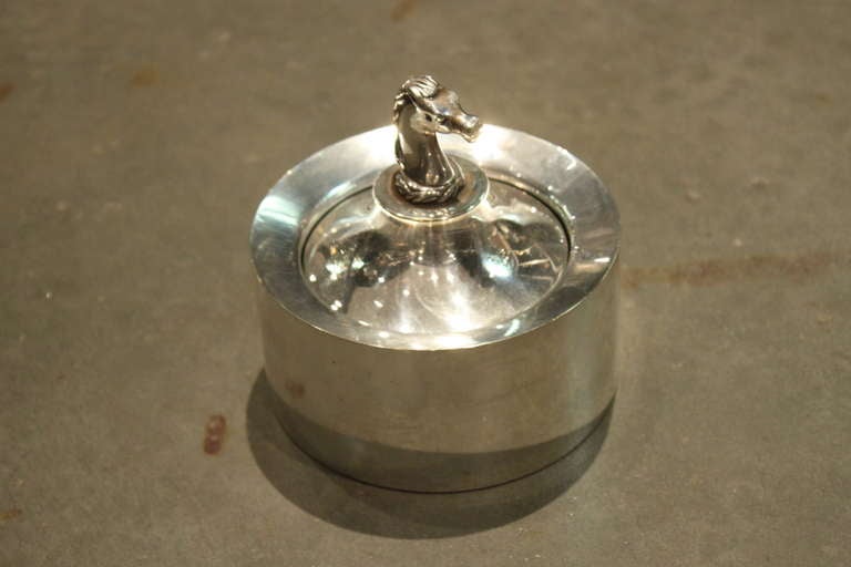 Super chic ashtray with push down mechanism to contain ashes. 
