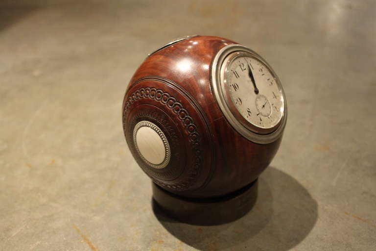 This unusual Lawn bowling trophy was fabricated in lignum wood silver and ivory with a revolving 8 day clock.  Presented to H.M. Tootell, Esq on Sept 3, 1927 from the I.P.M. Bowls Club.  