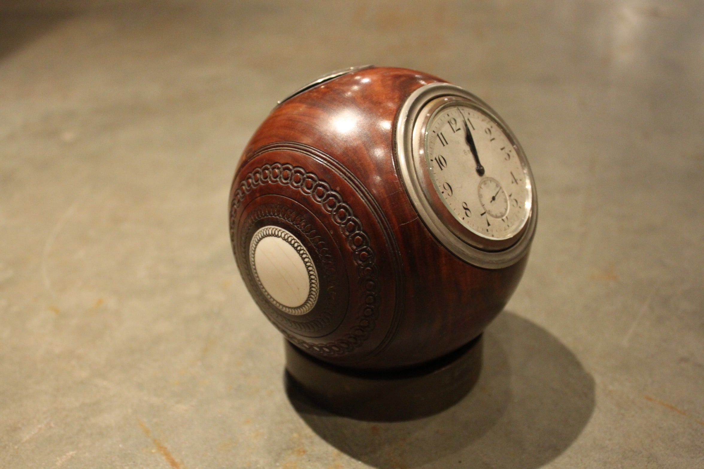 An Unusual Lignum wood and silver Trophy Lawn Ball Form Ball 8 day Clock  