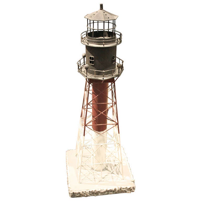 Perfect for summer, this model of a lighthouse would make a wonderful accessory for any home especially a seaside residence.