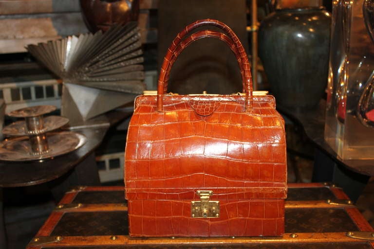 This rare Hermes Sac Mallet from the 1950's is in amazing condition.
The bottom of the bag is a jewlery box . This Bag has been reissued by Hermes and retails for over $30,000. It is triple signed Hermes.