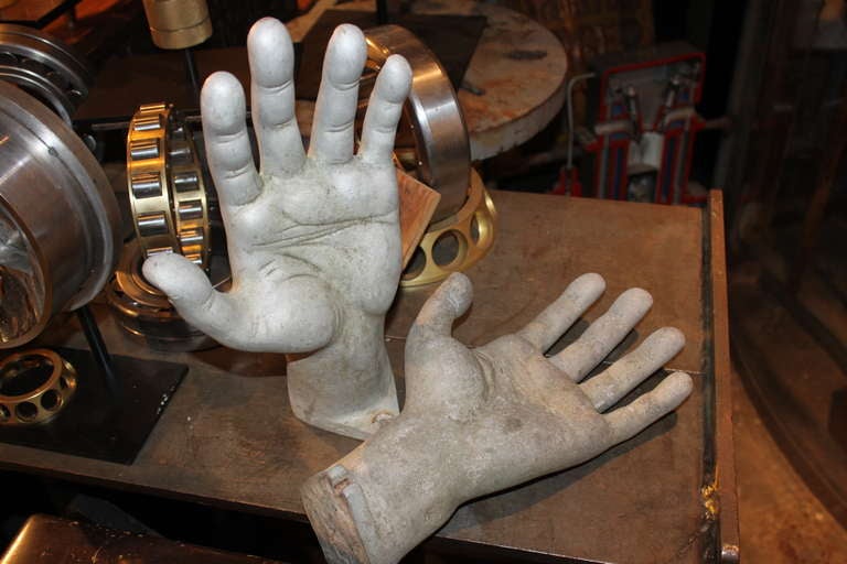 These may have been molds for oversized costume hands in latex , rubber eye. They can stand vertically or mount to the wall by the integrated flanges at the base.These are in as found condition with original patina. They could be high polished.