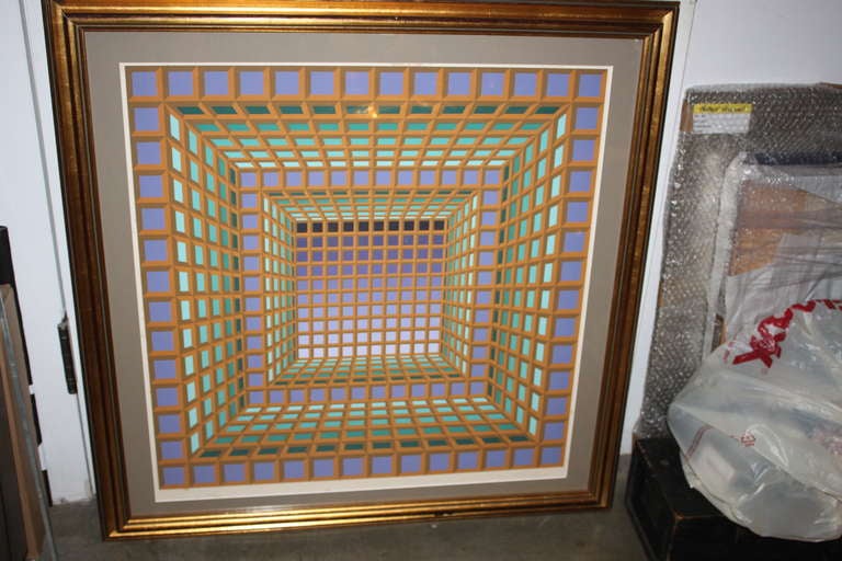 This is a very unusual lithograph by Victor Vasarely. Considered one of the most important pioneers of optical art, this large scale litho is signed and numbered in pencil. The color way is extremely unusual 
and impactful.The condition is