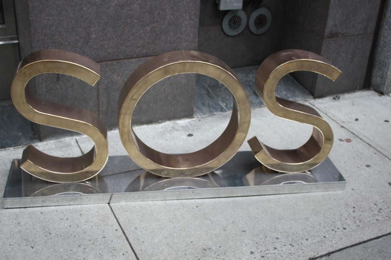 This sign was purchased in Paris. We high polished the bronze letters and the aluminum base. The contrast is powerful. We are unsure of its origin as to whether or not it was for a restaurant, club etc.but fantastic never the less.