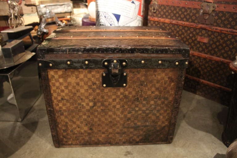 This is a lovingly worn and well traveled Vuitton trunk. The size of this LV makes for a perfect side table or just great storage!