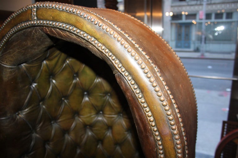 We can't get over the scale and amazing patina of this Porters chair. This chair was once sitting in one of the grand lobbies of one of New York's grand Hotels.It appears that the color was originally olive green. It has turned into this amazing