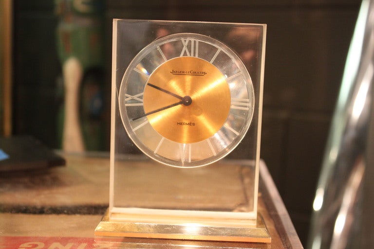 Hermes lucite and gold plated brass clock. The movement is made by Jaeger Le Coultre