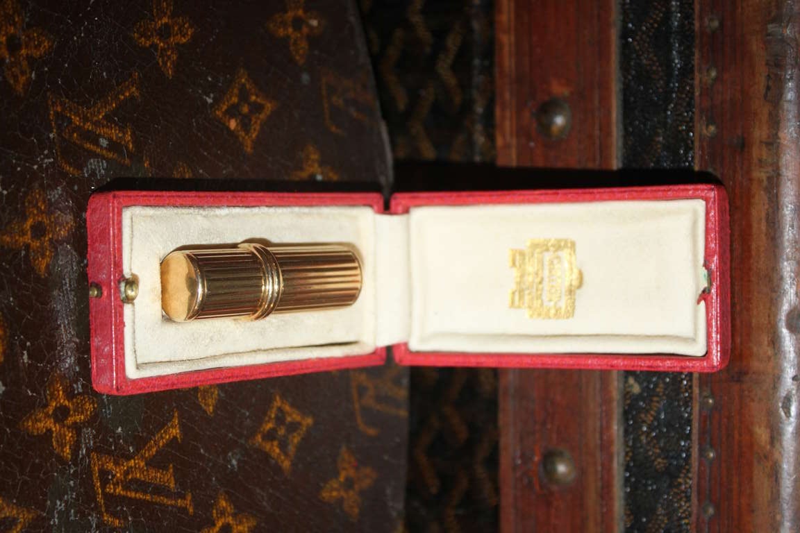 Cartier London pocket lighter made of 18k and comes in the original box. The design is super art deco.