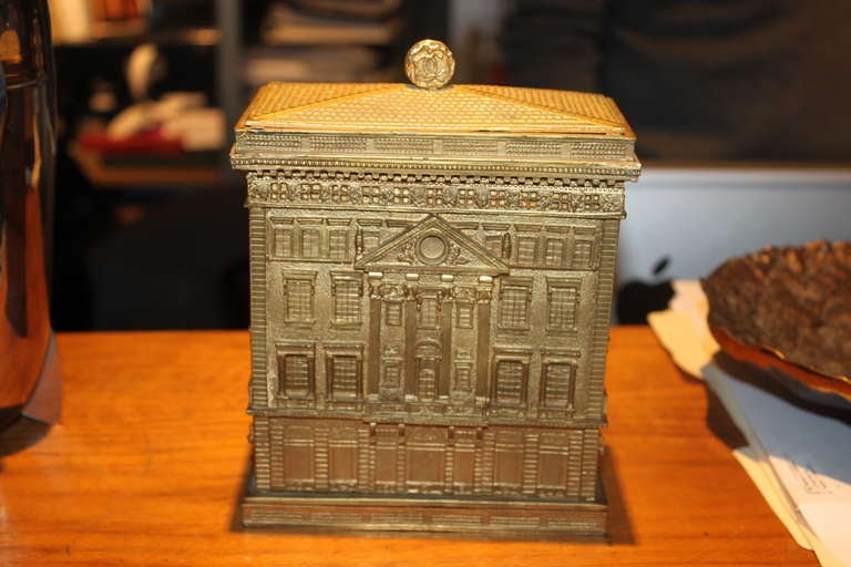 Rare Cartier figural Jewelery box of the Cartier Buliding. It dates from the 1940's  and has 3 trays . It is made of white metal and is gilt.