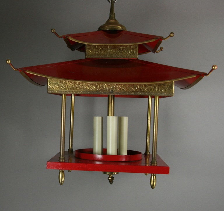 #1-2856 Circa 1950's a three light red and brass pagoda lantern.