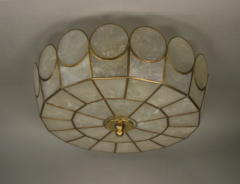 #1-2871  A round scalloped 1940's capiz shell flush mount.

Takes 3  60watt edison based bulbs