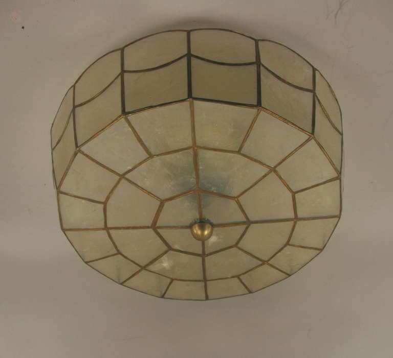 #1-2893 A scalloped capiz shell flush mount .

 Fixture takes 3 internal 60 watt edison  base bulbs