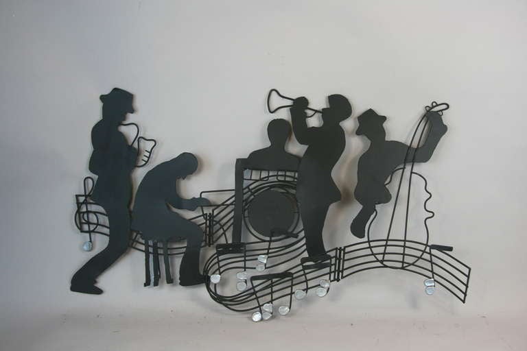 5-754 Torch cut metal  wall sculpture featuring a jazz quartet.