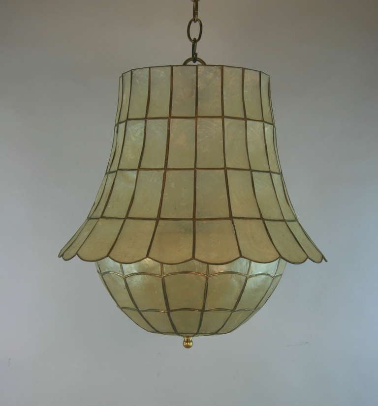 #1-2910 A large bell shaped capiz shell pendant.
Three internal lights  each  light 60 watt edison based bulb