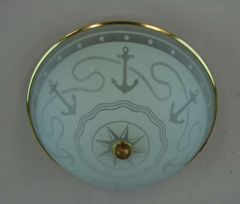 1-2911 frosted and clear glass nautical flush mount. 
Takes 2 60 watt edison based bulbs.