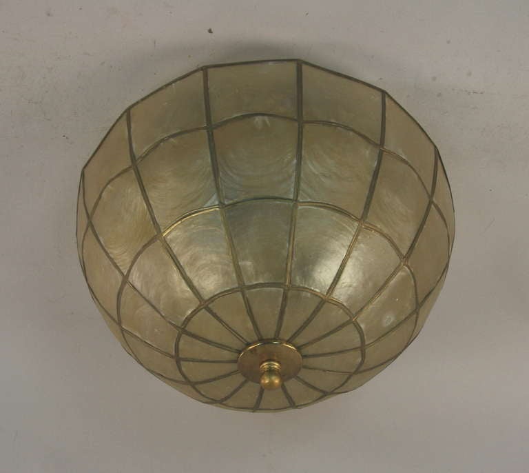 #1-2922, dome shaped capiz shell flush mount . Takes two 60 watt Edison based bulbs.