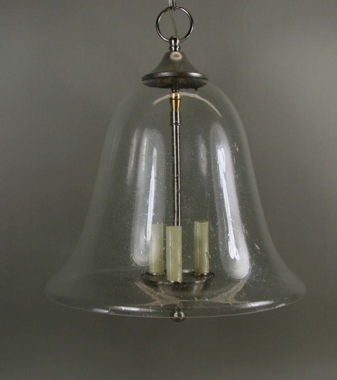 (three available)  #1-2561a   Hand blown bubble glass bell lantern with three light cluster.
Dark brass finish also available

Reg price $2400 on sale $1675net