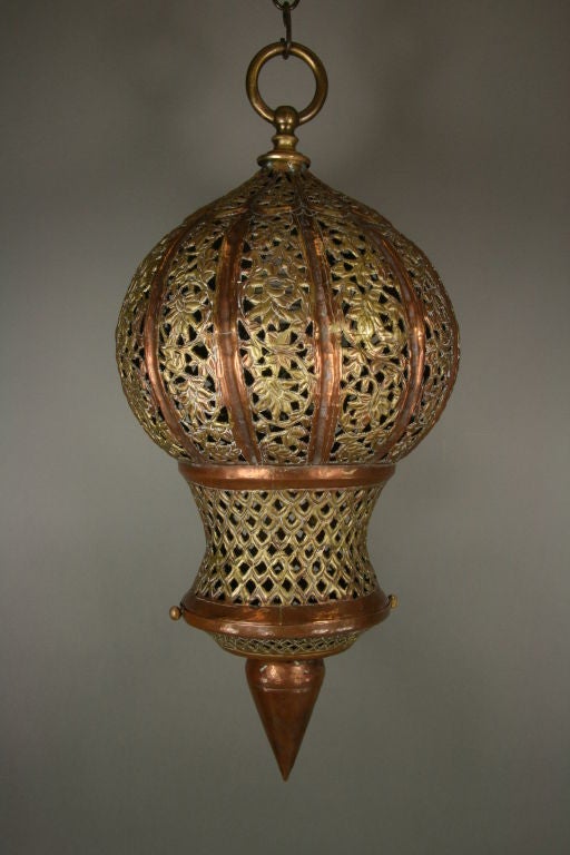 #1-2566 A Moorish-style pierced brass and copper pendant.
