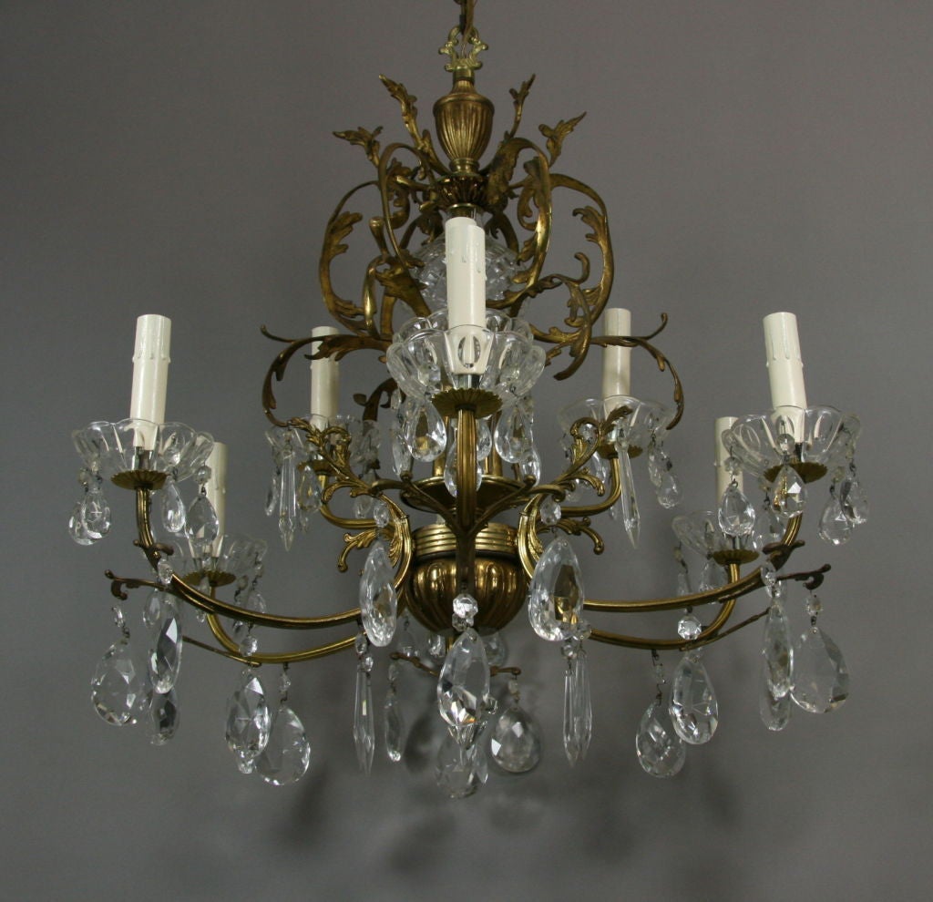 #1-2295 A foliate brass nine arms two levels crystal chandelier dressed with crystal prism.
ON SALE Regular Price $3200 on sale $1600 no additional discounts
Rewired supplied with 3 feet of chain and caonpy