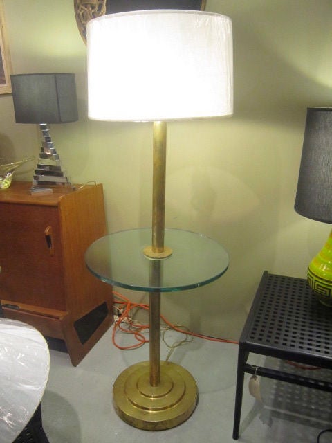 floor lamp in brass and glass shelf  from the 1930's 
new shade / located in NY