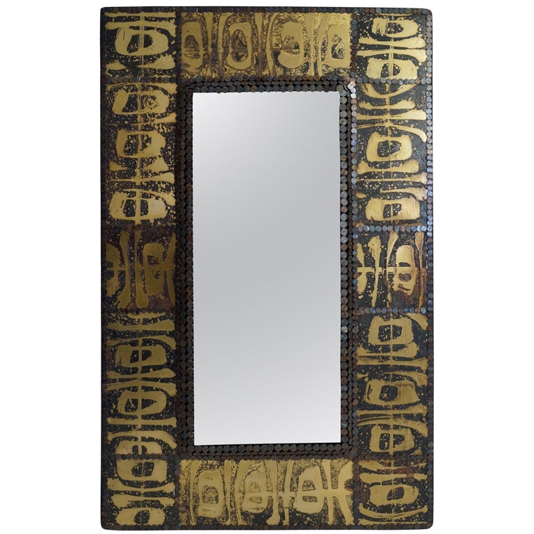 Miroir clouté en laiton