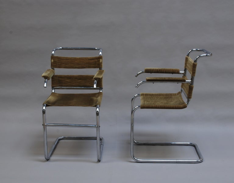 Set of four French 1940s tubular chromed frame chairs.