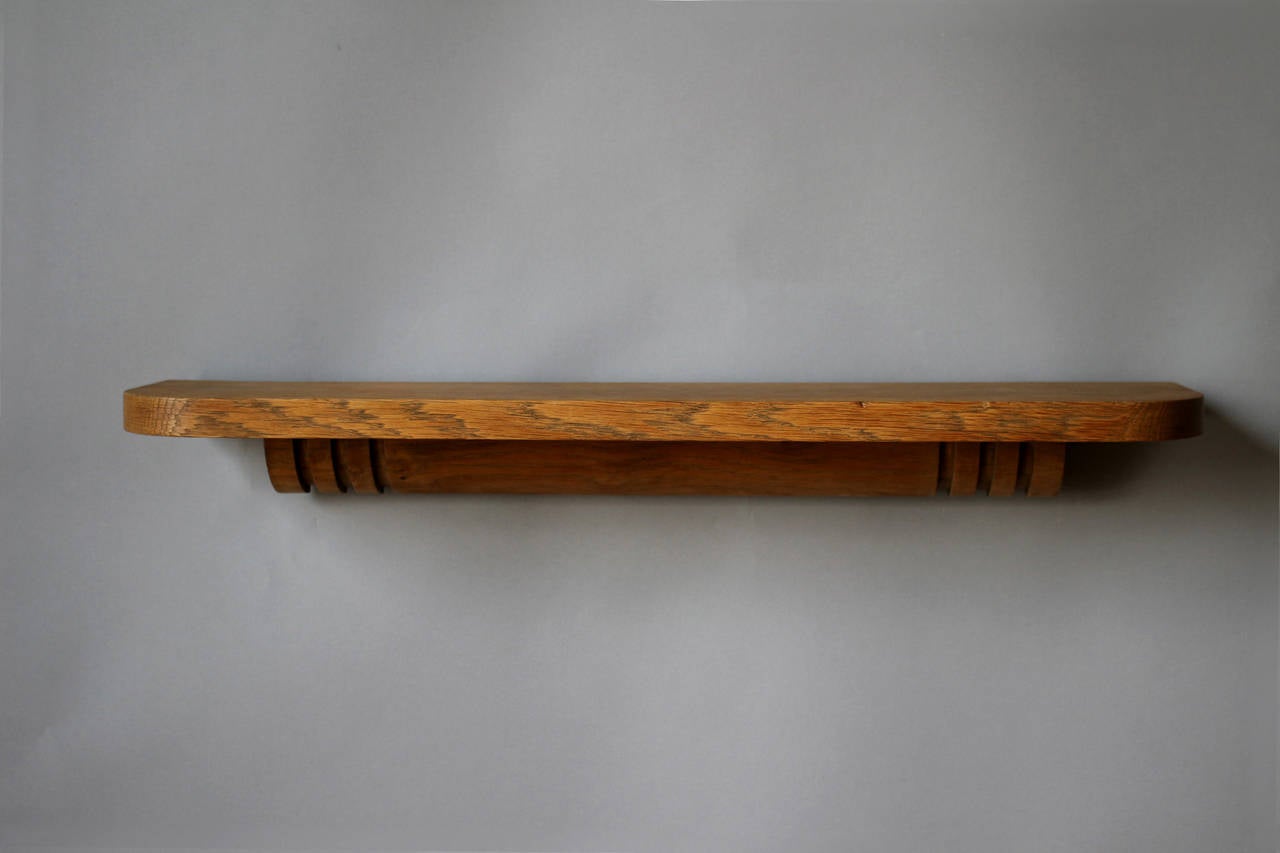 Two French Art Deco floating oak shelves by Charles Dudouyt.