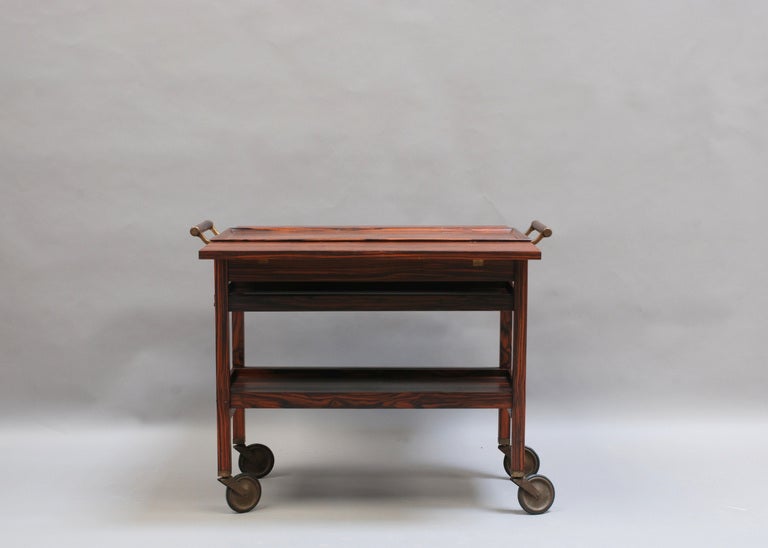 Fine French Art Deco Macassar rolling cart or serving table with bronze details. Sliding trays.
Dealer Ref: 805