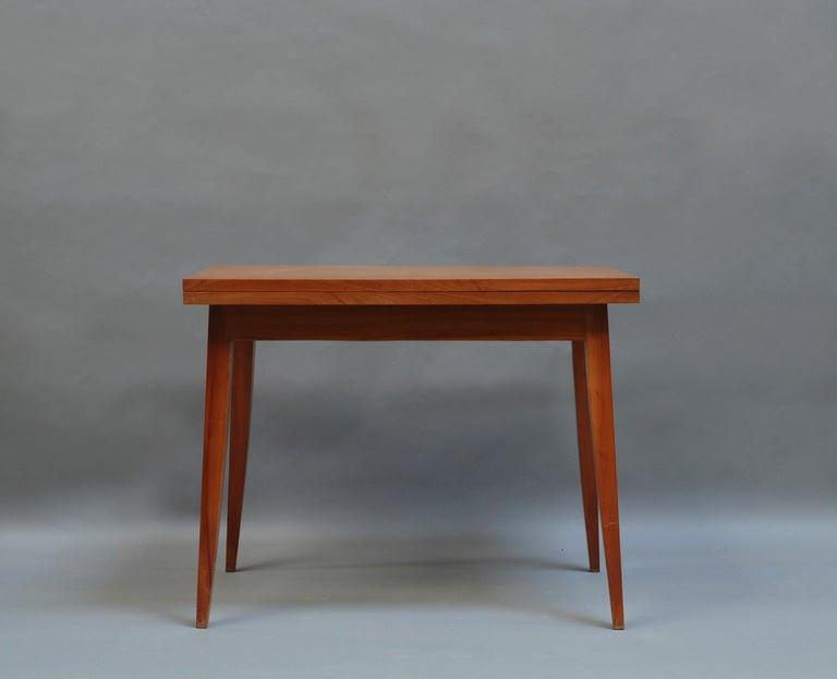 French 1950s cherry folding table.
Dimensions opened: 43 1/2