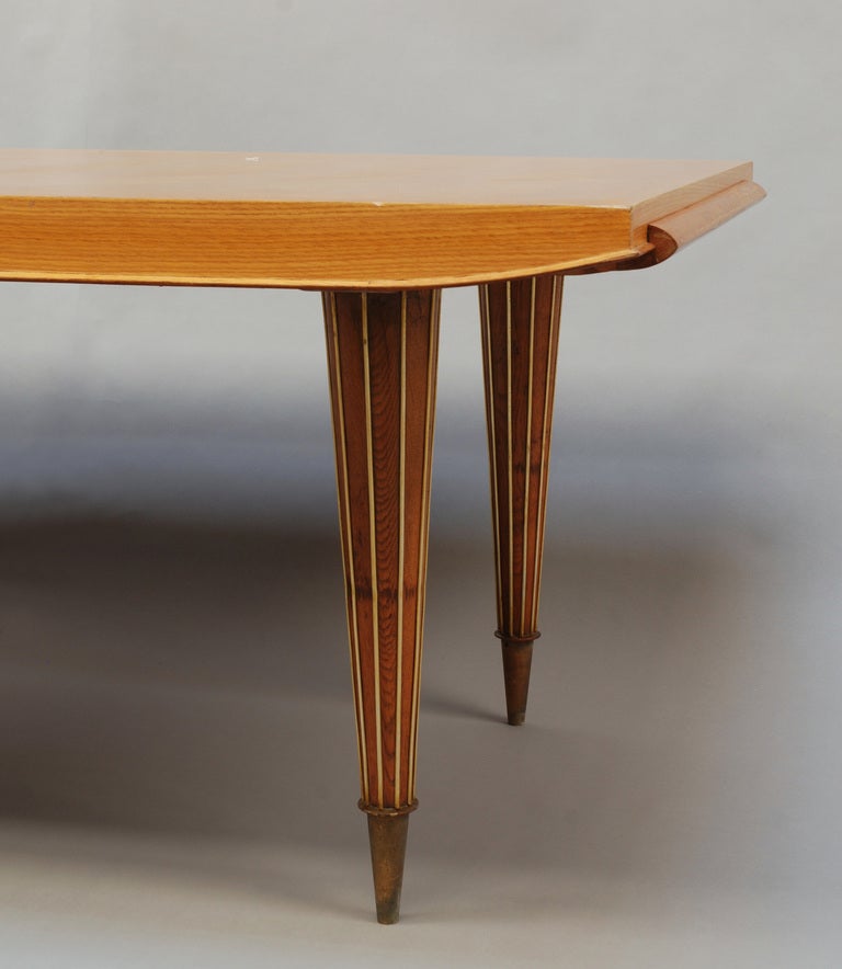 A Fine French Art Deco Expandable Dining Table with Ribbed Brass Conical Legs For Sale 2