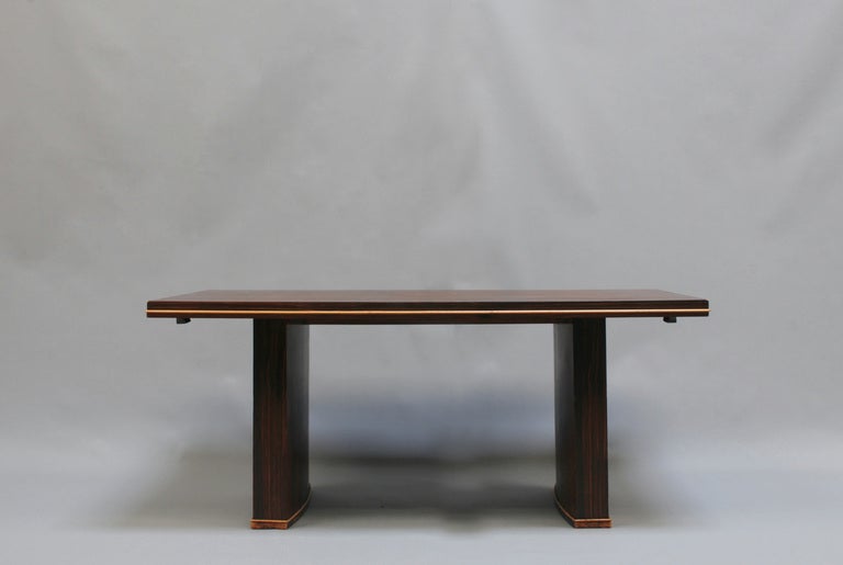 French Art Deco macassar dining / writing table with 2 matching end leaves and sycamore molding.