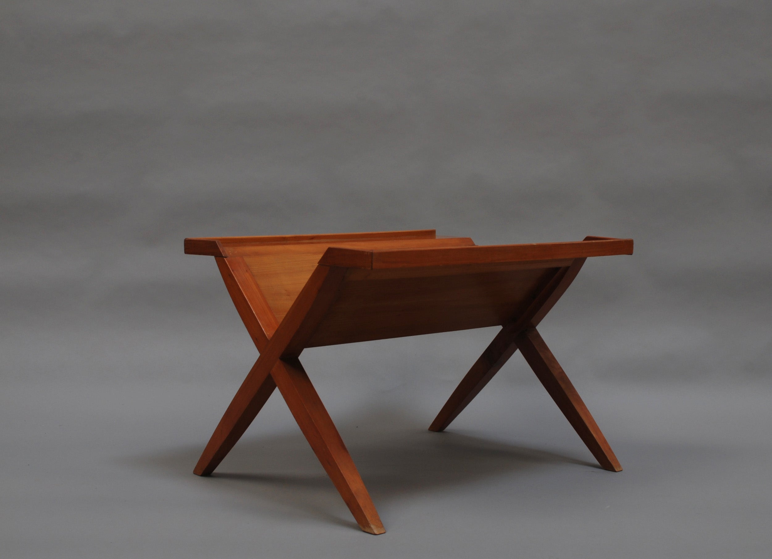 A fine French midcentury cherrywood magazines rack or sofa table by Roger Landault.
Documented.