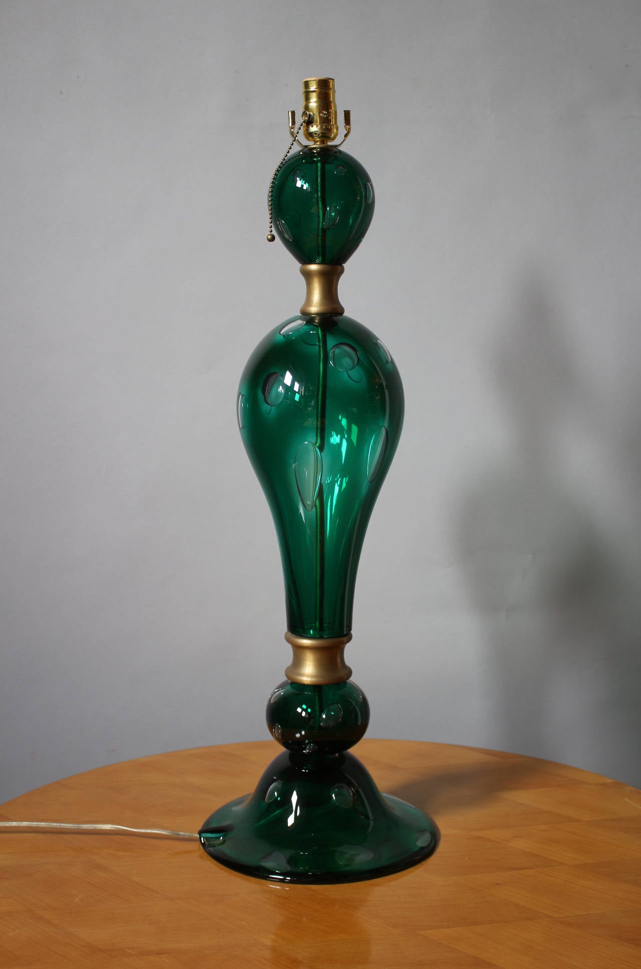 Fine large 1970s hand blown green glass Murano table lamp with brass detail.
US re-wired