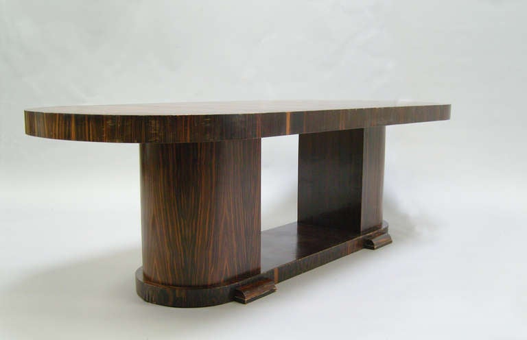 A large fine French Art Deco two pedestals macassar ebony oval dining table.
Price include restoration (done) and refinishing per your request.     