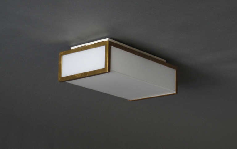 Small French Art Deco rectangular brushed brass and white glass ceiling light / sconce by Jean Perzel.