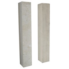 A pair of French Art Deco Travertine Pedestals in the Manner of Marc du Plantier