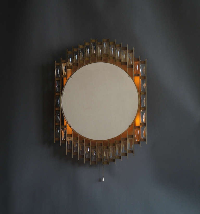 Unusual French 1970s illuminated mirror with a metal and glass pendant frame.
 U.S re-wired with a fabricated new splice box for easy installation.