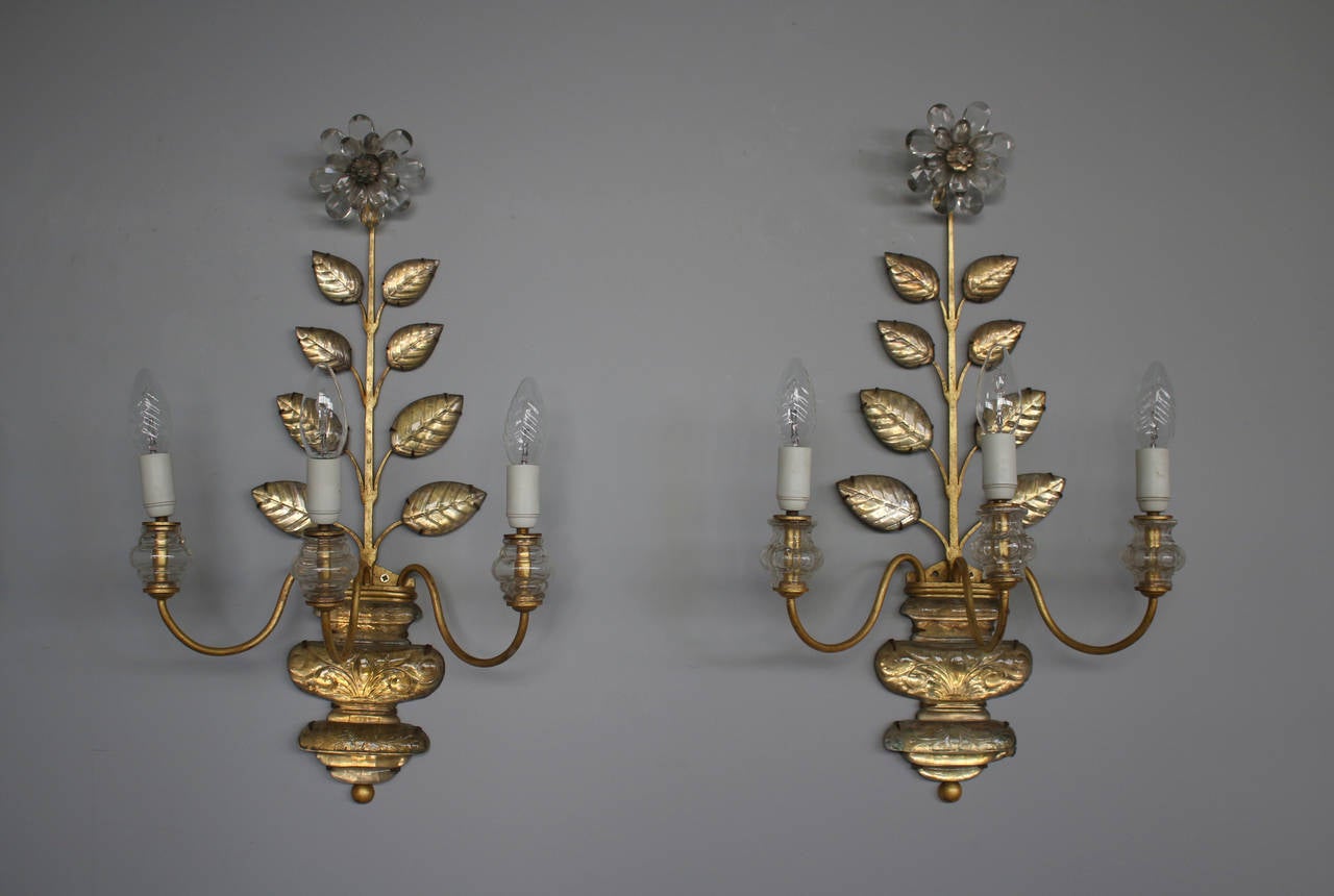 A pair of fine French Mid-Century gilded glass mounted on a gilded metal base by Maison Baguès.
  