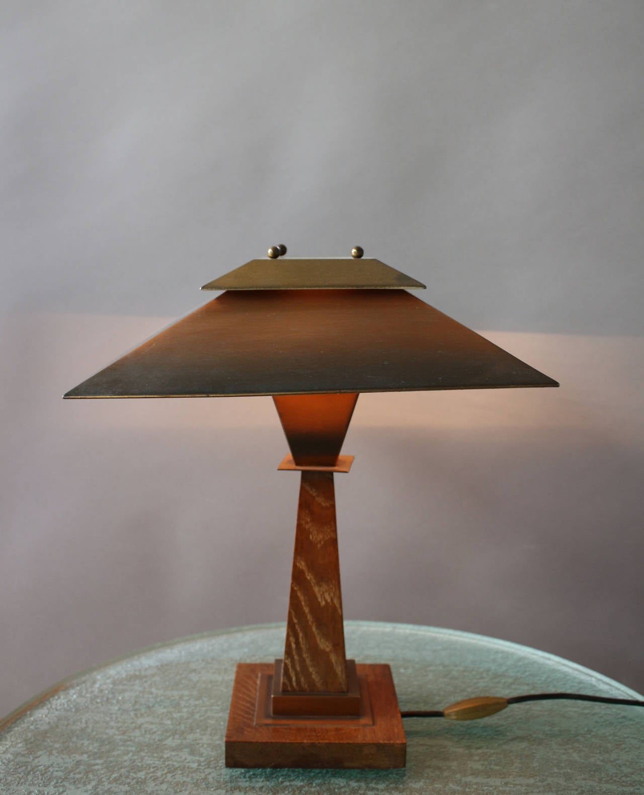 A fine French Art Deco cerused oak pedestal table lamp with a pagoda shaped copper shade.
   