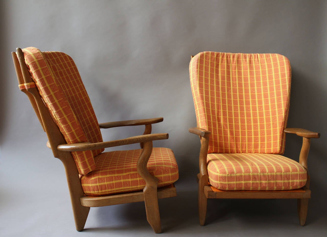 Pair of French 1950s oak armchairs by Guillerme et Chambron.
Model 