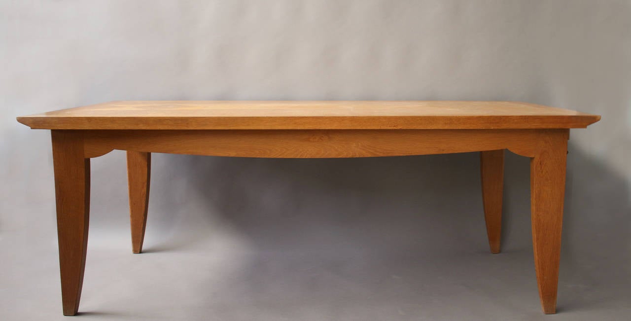 Fine French Art Deco oak table designed by Pierre Bloch and edited by Charles Dudouyt (founder of La Gentilhommière).
Two original end leaves (width is 98 1/2