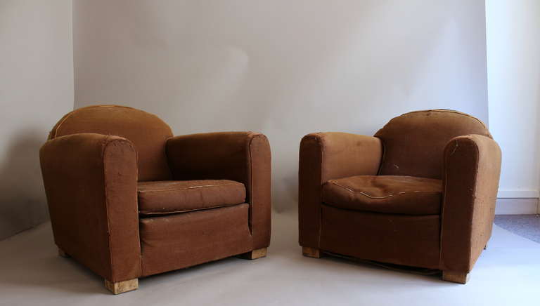 Pair of French Art Deco club armchairs by Adnet.
  