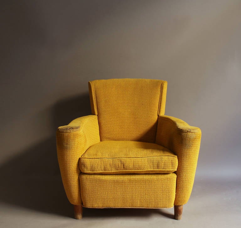 A Fine French 1940's armchair by Batistin Spade with wooden legs.