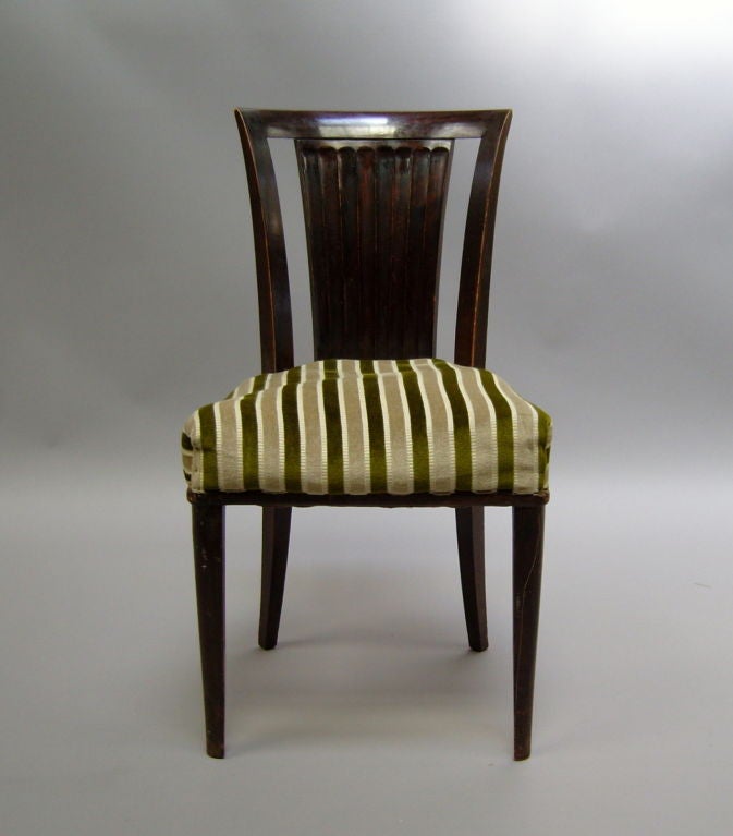 A set of six fine French Art Deco dining chairs in solid mahogany by Gaston Poisson.