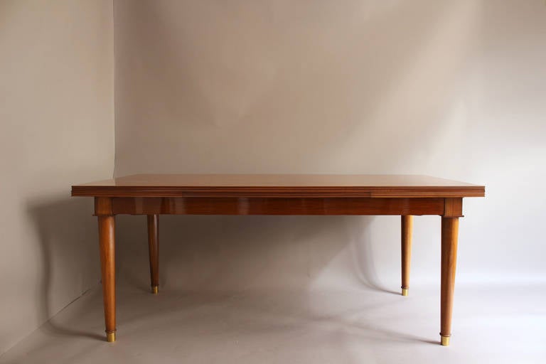 Mid-20th Century A Fine French Art Deco Walnut Extendable Dining Table by Jules Leleu