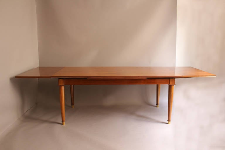 Bronze A Fine French Art Deco Walnut Extendable Dining Table by Jules Leleu
