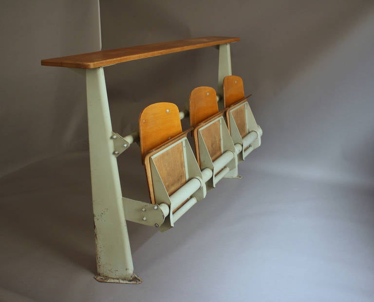 French 1950s metal and wood amphitheater folding seat or bench by Jean Prouve.
Provenance: ENSIC (école nationale supérieure des industries chimiques), 
Nancy, France.