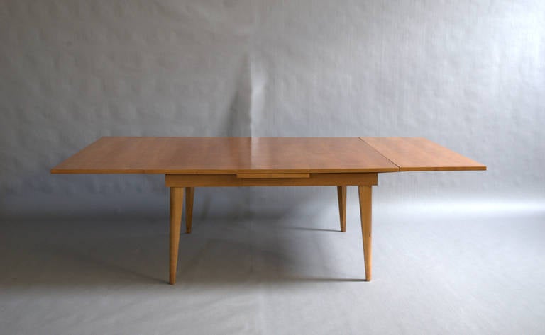 Mid-Century Modern A Large French 1950's Cherry Wood Dining Table with Two Pull-Out End Leaves For Sale