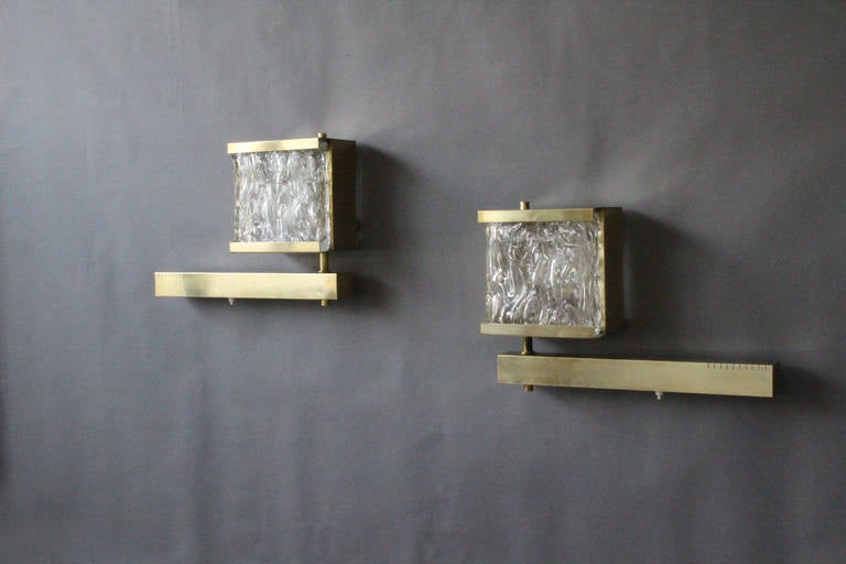 4 French brass framed and textured glass slabs sconces with a pivoting lighting arm (maximum depth is 19