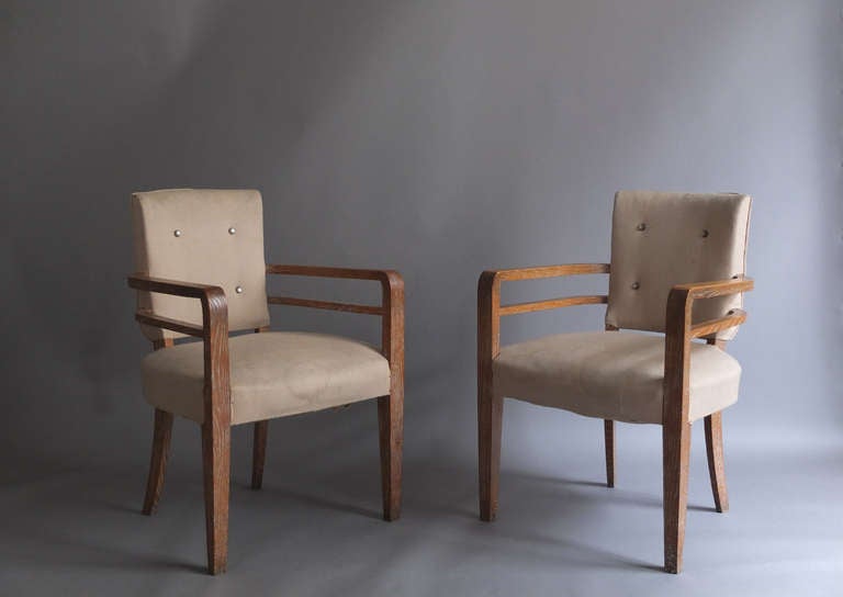 Set of six French Art Deco cerused oak bridge armchairs.
 